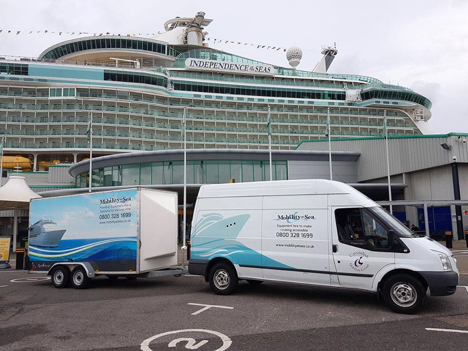 Our delivery vans by side of cruise ship making deliveries