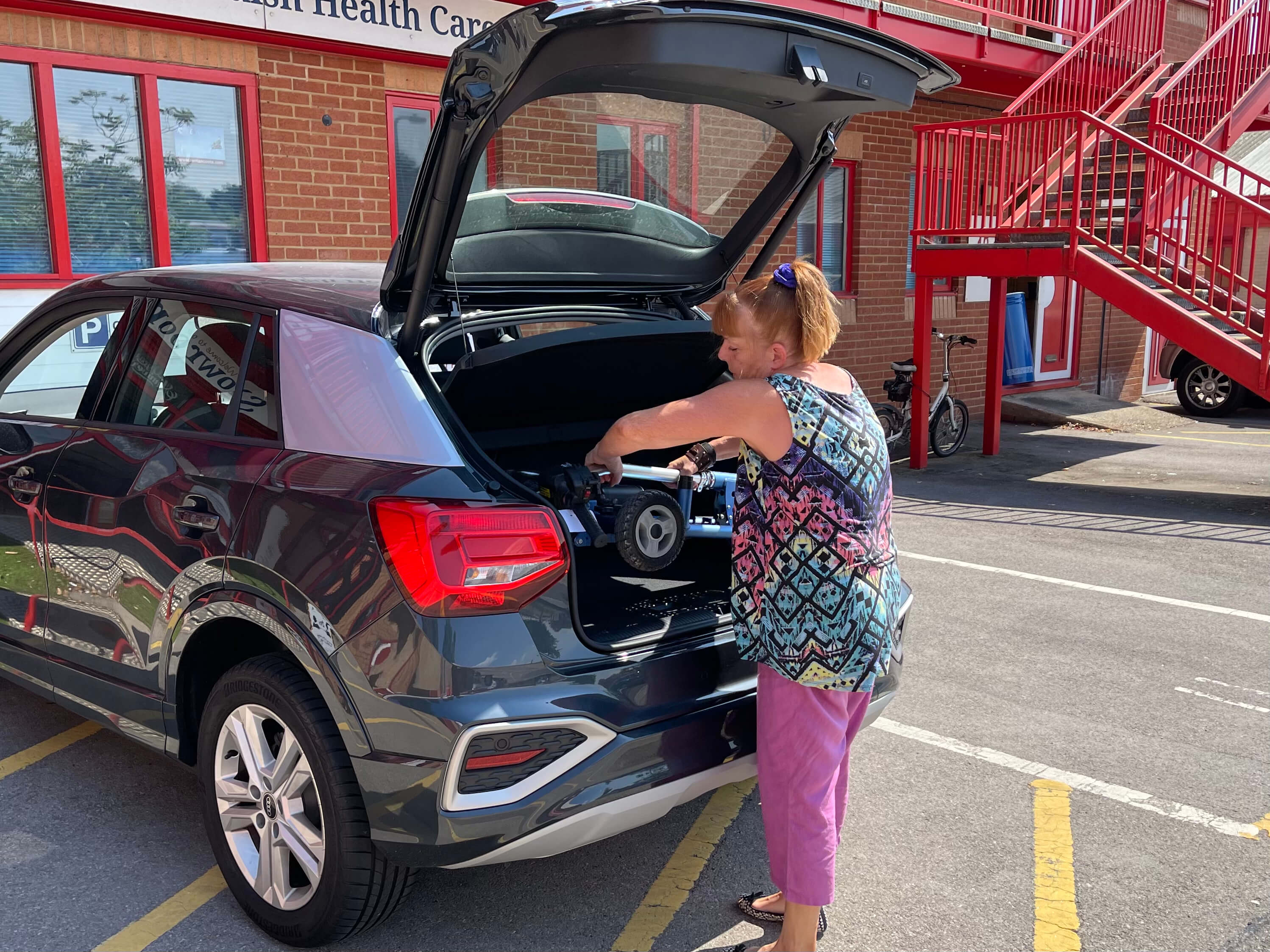 Loading a SupaScoota in to the back of a small car