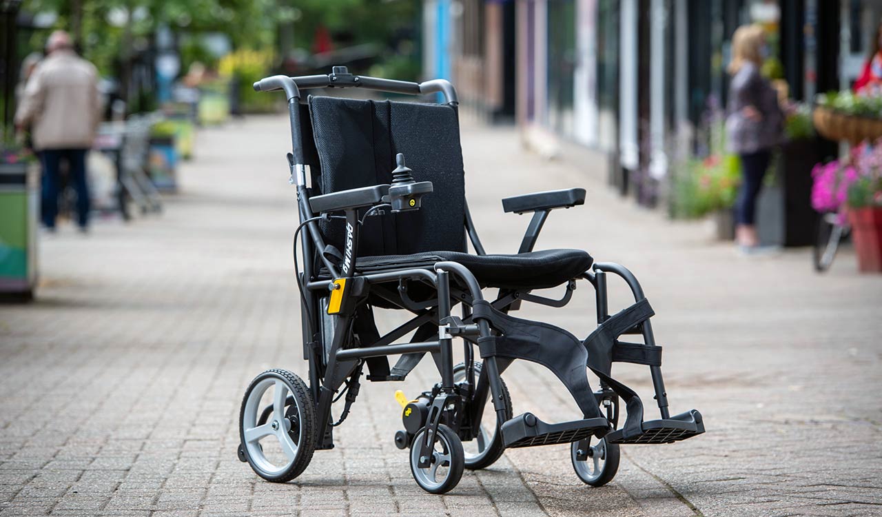 Dashi MG powerchair in shopping/pedestrian precinct