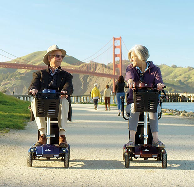 Couple enjoying their i3 mobility scooters