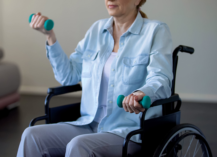 Woman exercising is wheelchair